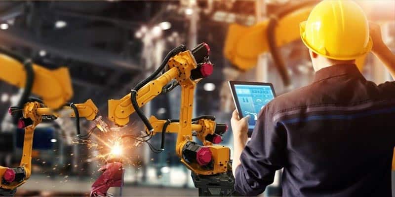 Engineer Monitoring Automated Welder