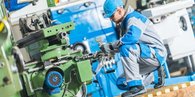 Mechanic Working on Machinery